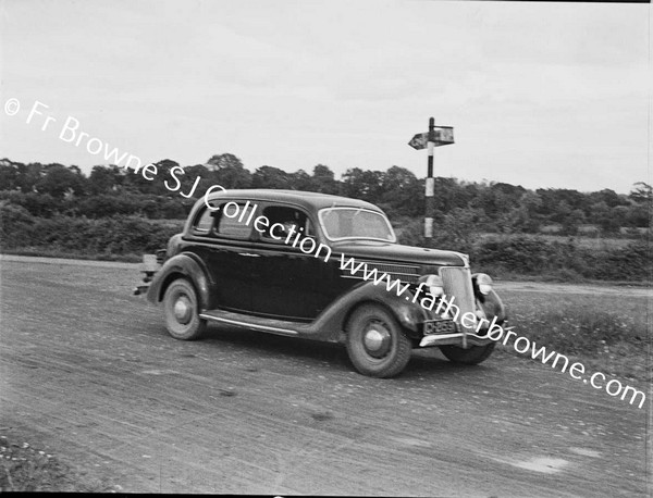 BROTHER JOE KEARNEY S.J. WITH FORD V8 NEAR CANAL BRIDGE EMO